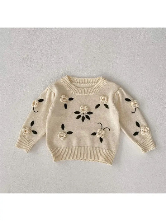 Flower embroidered sweater.